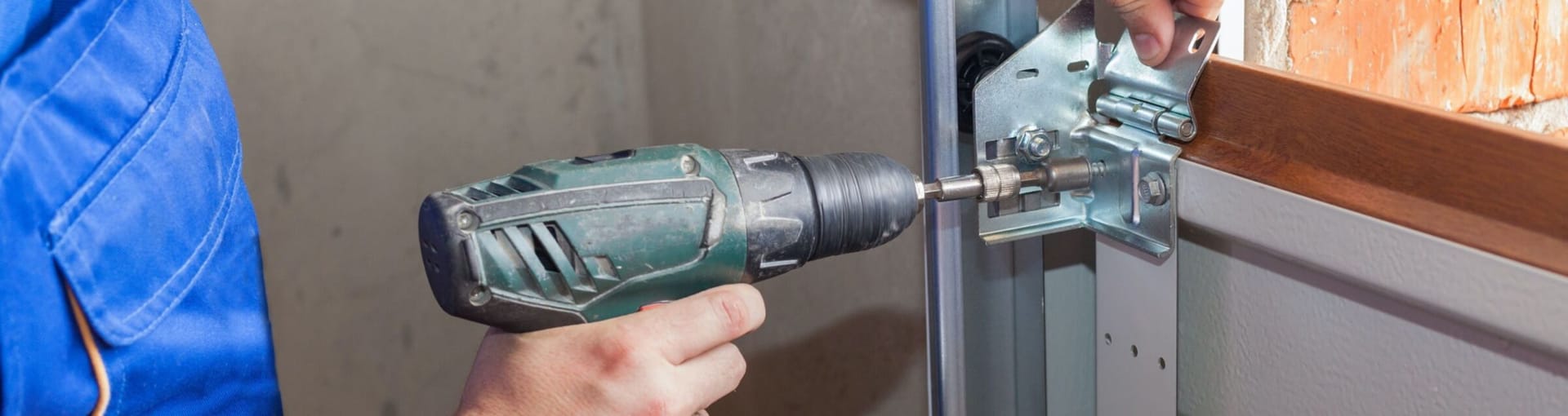 Sears technician performing garage door repair service